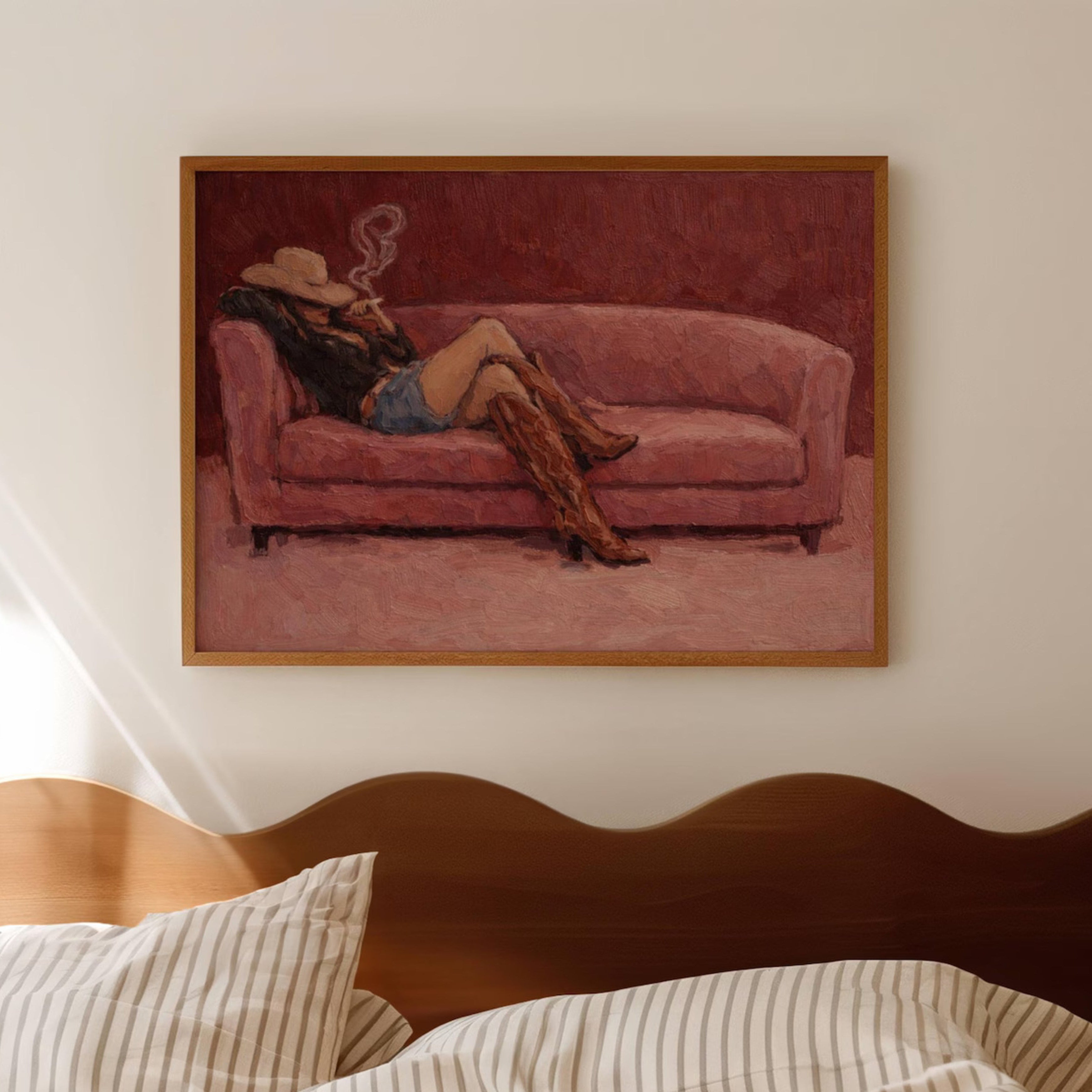 abstract Western wall art featuring an off-duty cowgirl reclining on a blush dusty pink sofa in cowboy boots and cowboy hat, inspired by western and contemporary folk aesthetics. This is a hand drawn Contemporary western art Print Oil Painting.