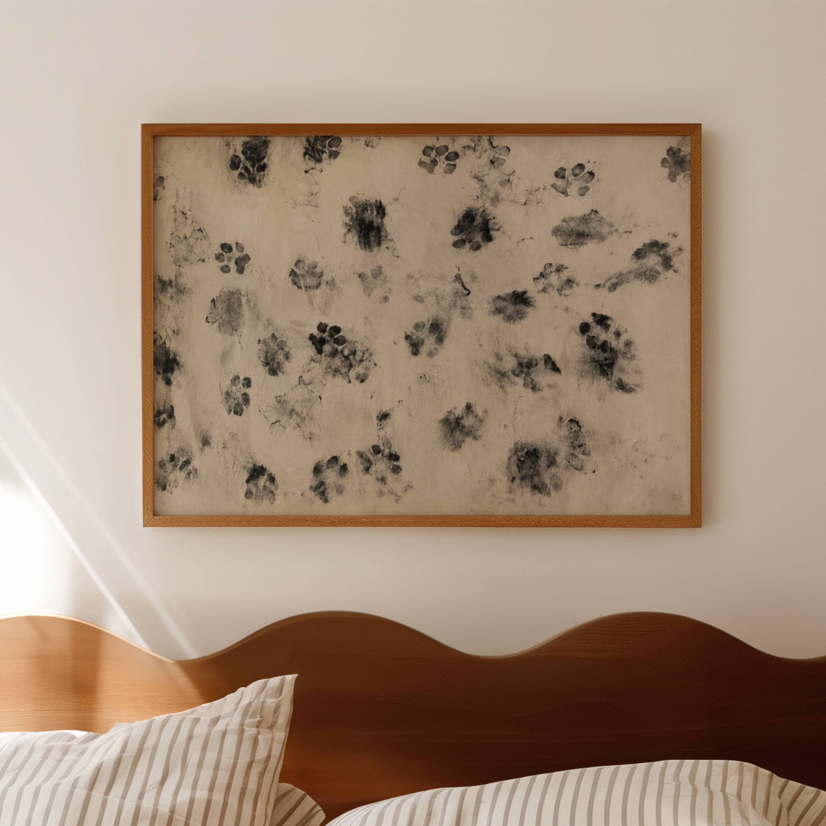 proof of life is a retro vintage wall art print with abstract dog paws scattered across a surface, on a textured neutral background. Featuring soft monochromatic markings in an abstract contemporary painting style.