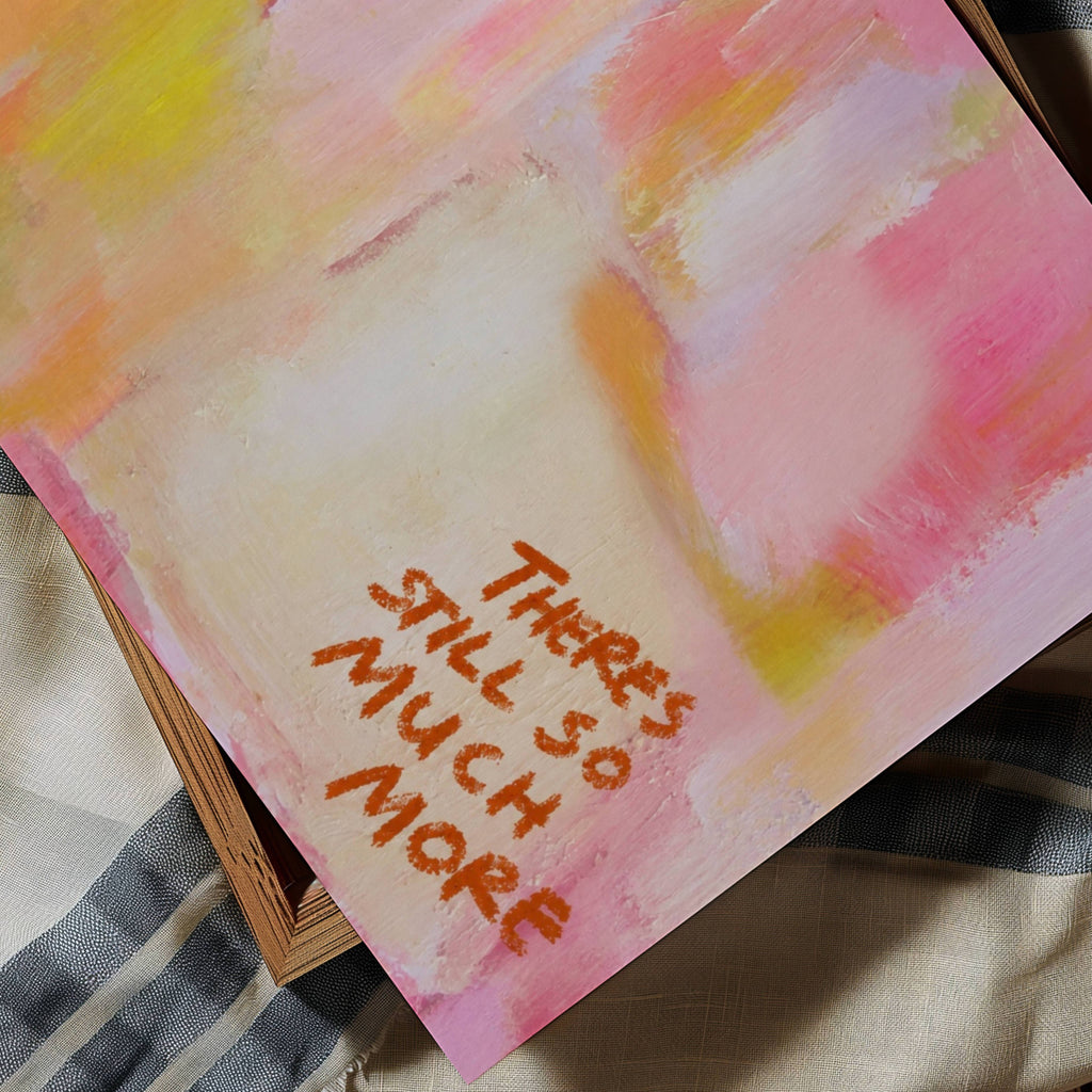hand drawn Trendy typography abstract print with the motivational quote "THERE IS STILL SO MUCH MORE" in a textured abstract painted canva with brush strokes in pink colors. This is a trendy minimal typography wall art print ideal for above bed, bedrooms, dorm room decor, living rooms and kitchens, gallery walls and playful interiors. The perfect Cool Girl Apartment decor