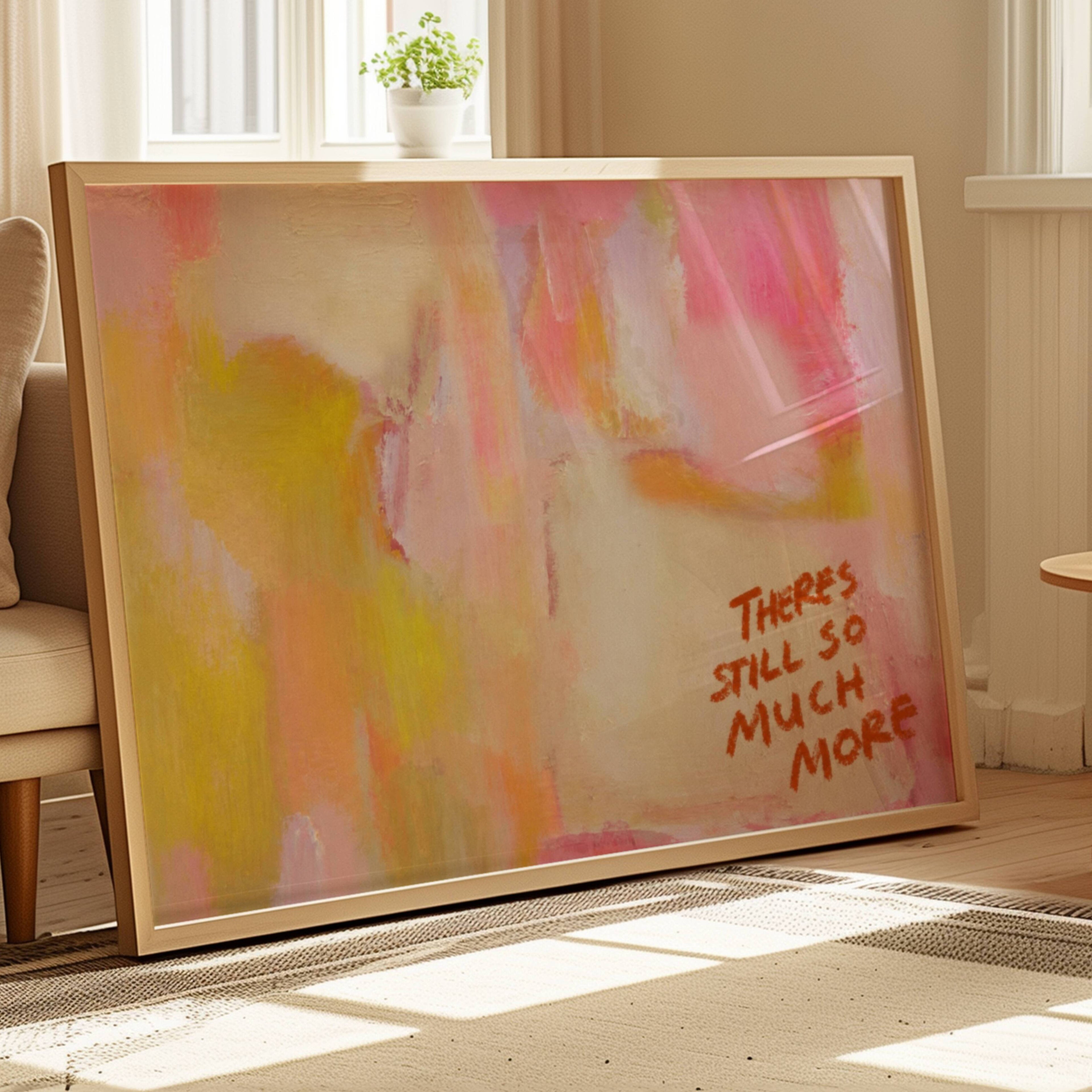 hand drawn Trendy typography abstract print with the motivational quote "THERE IS STILL SO MUCH MORE" in a textured abstract painted canva with brush strokes in pink colors. This is a trendy minimal typography wall art print ideal for above bed, bedrooms, dorm room decor, living rooms and kitchens, gallery walls and playful interiors. The perfect Cool Girl Apartment decor