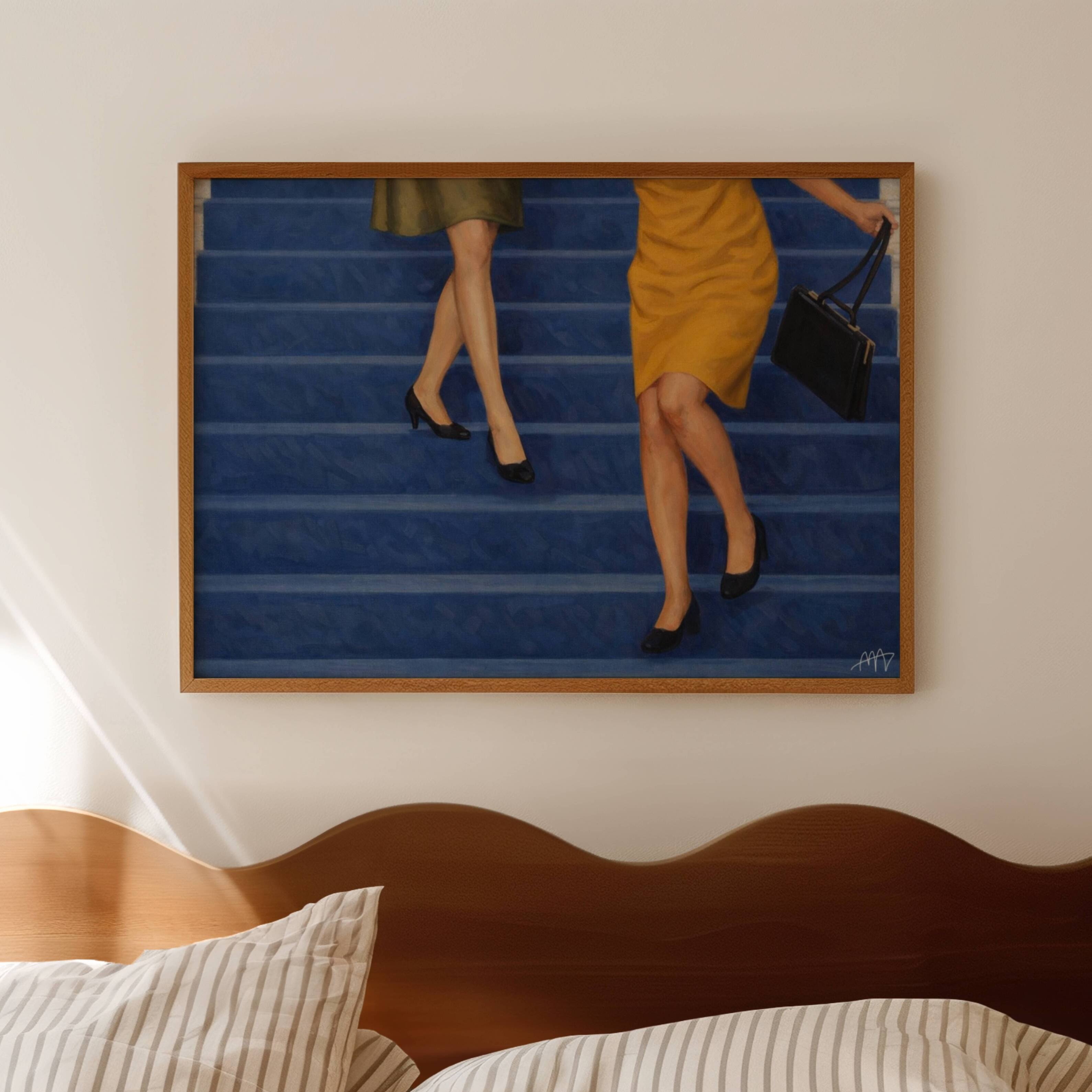 The Blue Staircase is a hand painted Contemporary and figurative wall art of two women descending deep blue stairs, inspired by European cinema and nostalgic mid century aesthetics, against a blue background with expressive painterly texture. Minimalist Feminine Mid century modern oil painting in cinematic nostalgia composition.