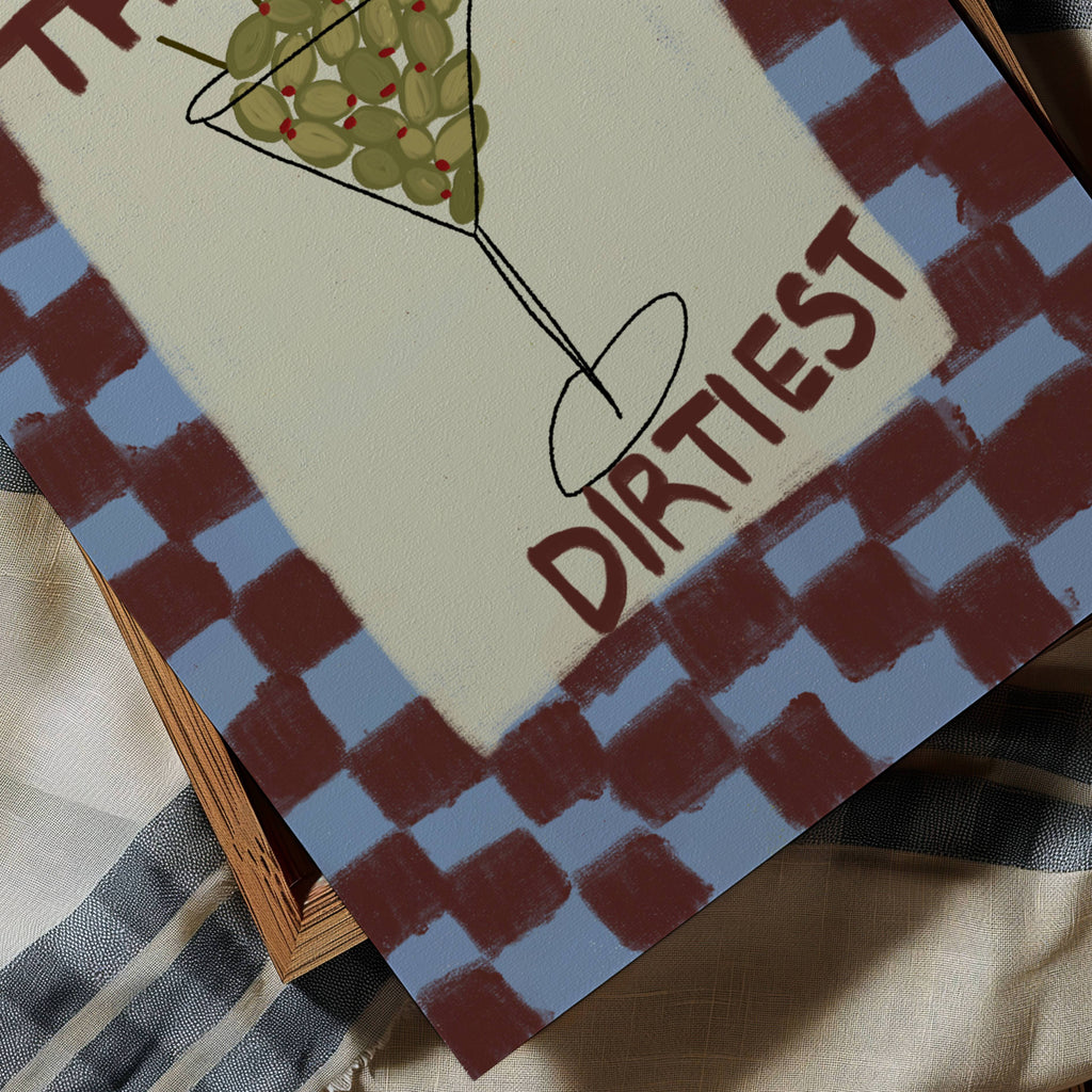 Playful Hand drawn Kitchen Funny Typography wall art with an Olive Martini illustration and the phrase "The Dirtiest" on a retro checkered background in blue and burgundy tones. This is a hand drawn Oil Painting kitchen and bar cart art Print decor.