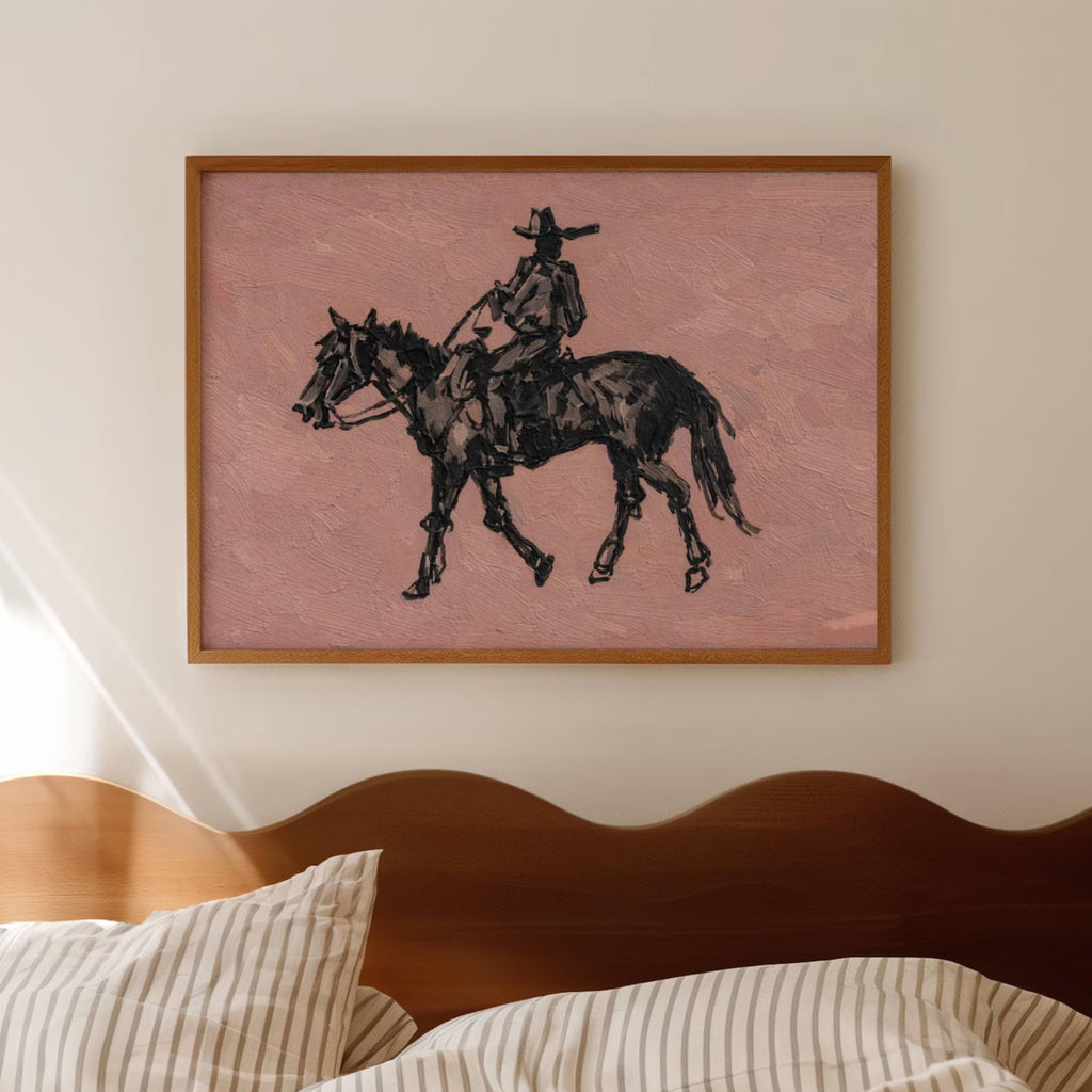 The Lone Rider is a minimalist Western Horse Artwork Featuring solitary rider cowboy on horseback against dusty rose pink background. This is a western Cowboy Oil painting wall art with painterly effect