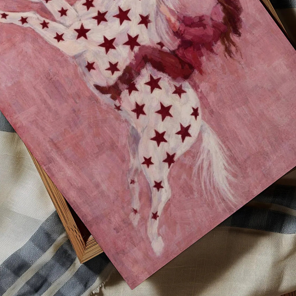 contemporary western folk style artwork of a cowgirl woman riding a star patterned horse with red burgundy stars on a pink background. hand drawn painterly effect
