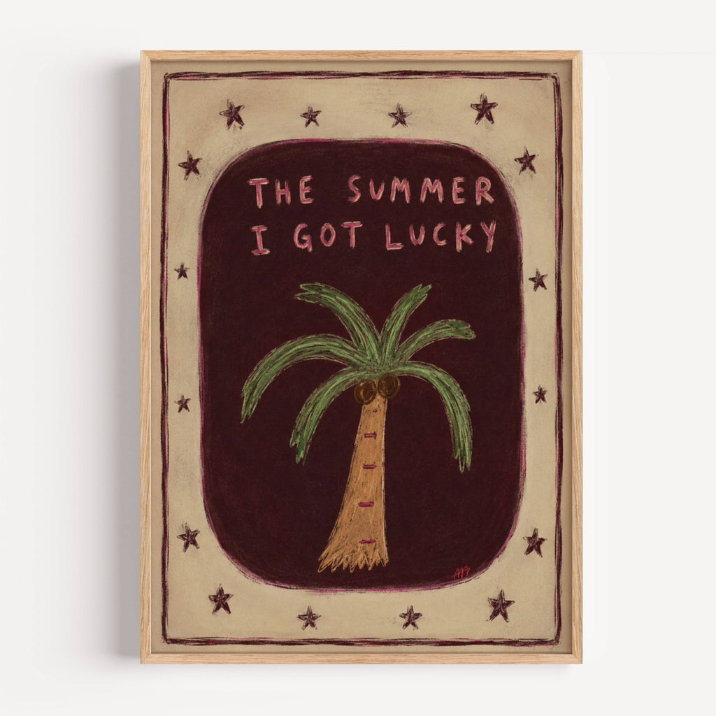 The Summer I Got Lucky is Centered around a playful hand-painted palm tree and framed by whimsical stars, the artwork blends nostalgic typography with expressive illustration, creating a piece that feels both carefree and deeply personal. Its rich earthy palette and naïve painterly style bring warmth, character and a touch of storytelling into contemporary interiors. for bedroom, living room or holiday home, it serves as a reminder that sometimes the most meaningful moments arrive quietly, disguised as ordi