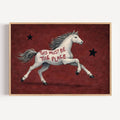 A surreal Symbolic artwork featuring a White Horse running against a rich burgundy background with black stars. The Horse has handwritten quote "This Must Be The Place". This is a hand drawn Contemporary Folk art Print Oil Painting.