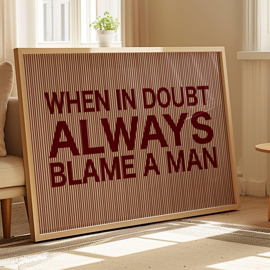 hand drawn Playful Funny typography print with the phrase "WHEN IN DOUBT ALWAYS BLAME A MAN" in a retro striped burgundy ruby canva. This is a trendy funny typography wall art print ideal for above bed, bedrooms, dorm room decor, living rooms and kitchens, gallery walls and playful interiors. The perfect Cool Girl Apartment decor