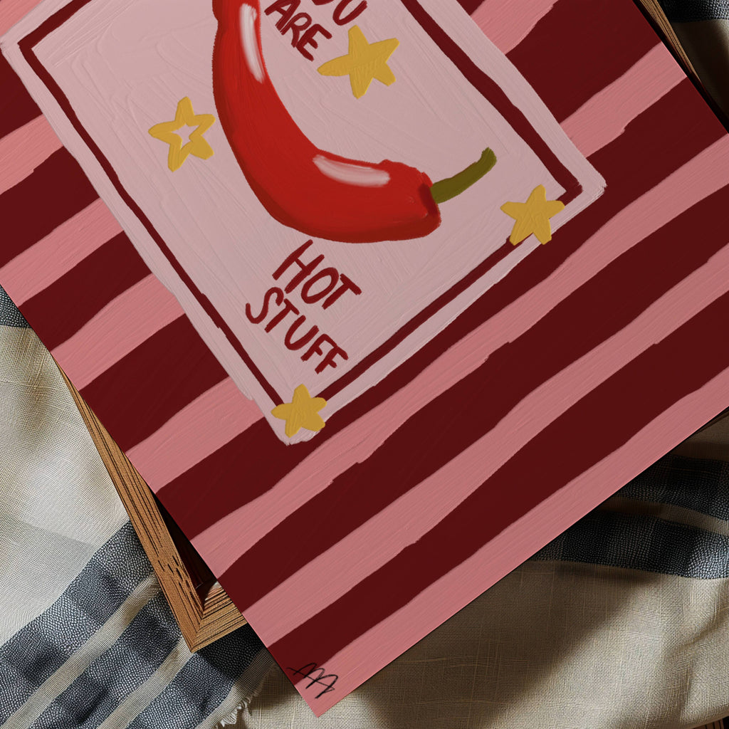 Playful Hand drawn Kitchen Funny Typography wall art with a hot red chilli peper illustration and the phrase "You are Hot Stuff" on a retro striped background in pink and ruby tones. This is a hand drawn Oil Painting kitchen and bar cart art Print decor for playful kitchens, dining spaces and eclectic interiors.
