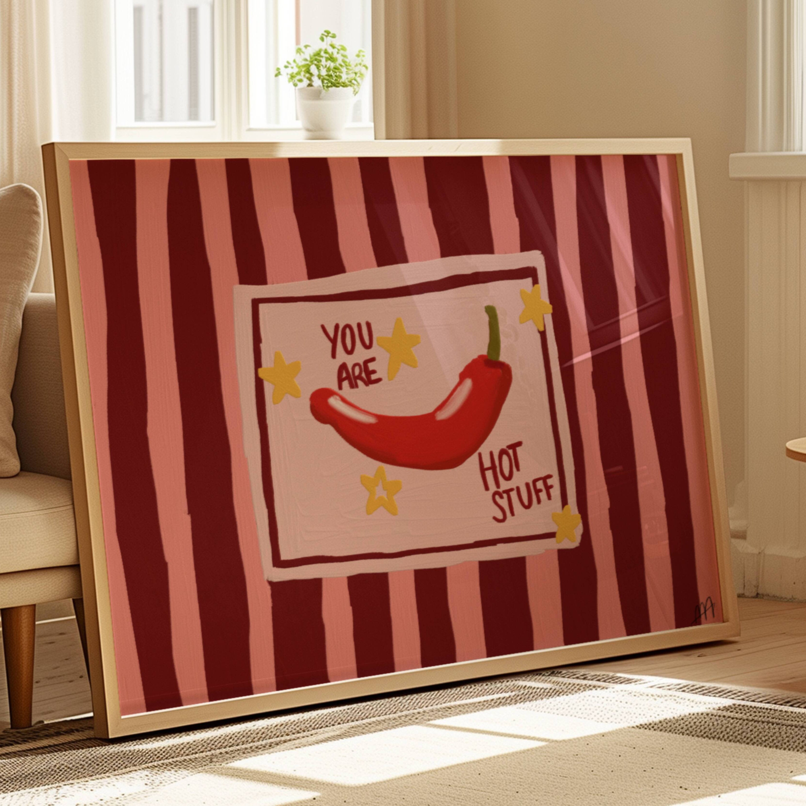Playful Hand drawn Kitchen Funny Typography wall art with a hot red chilli peper illustration and the phrase "You are Hot Stuff" on a retro striped background in pink and ruby tones. This is a hand drawn Oil Painting kitchen and bar cart art Print decor for playful kitchens, dining spaces and eclectic interiors.