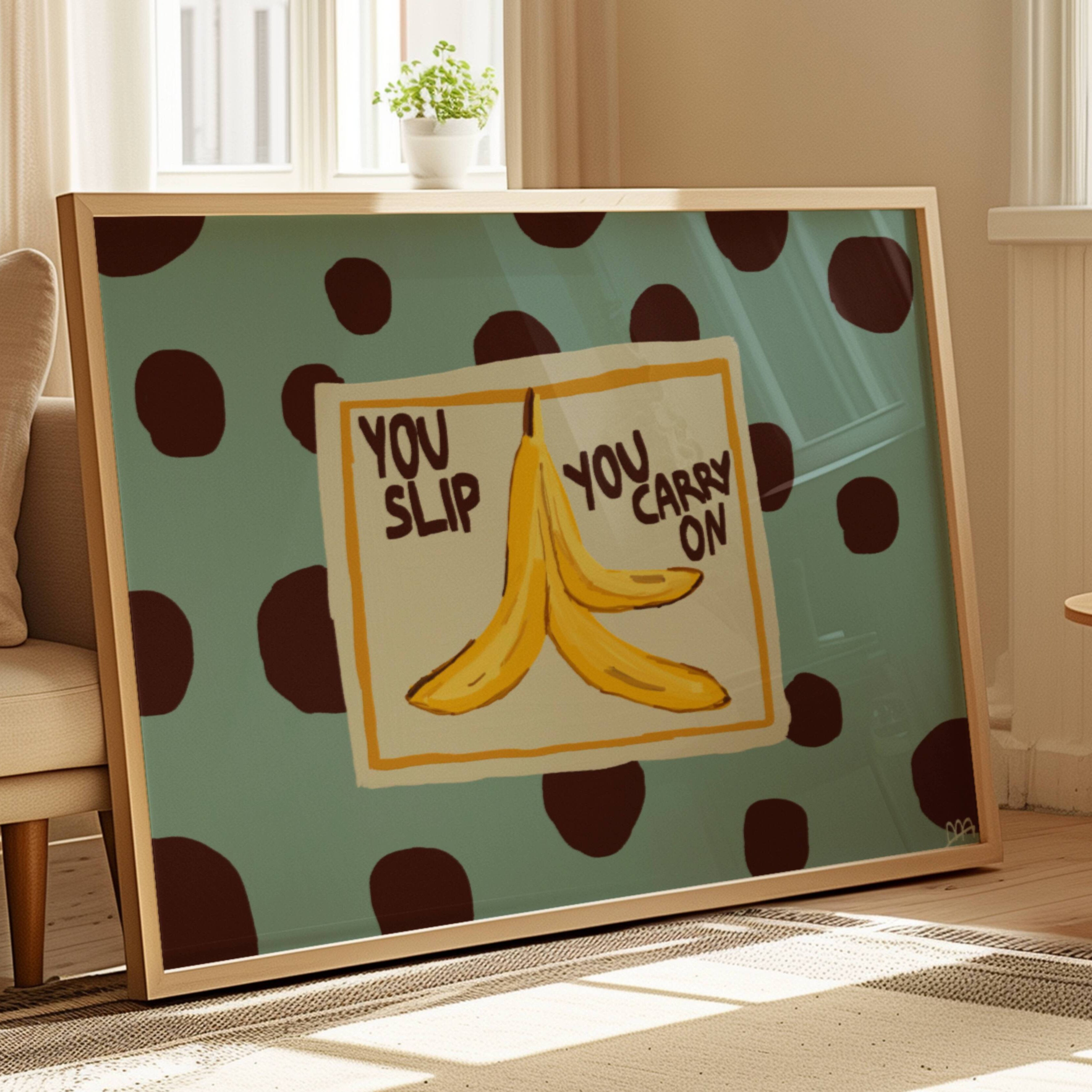 Funny Playful Hand drawn Kitchen wall art with a banana peel illustration and the phrase "You Slip You Carry On" on a blue polka dot background. This is a hand drawn Food Oil Painting kitchen and bar cart art Print decor for playful kitchens, dining spaces and eclectic interiors.