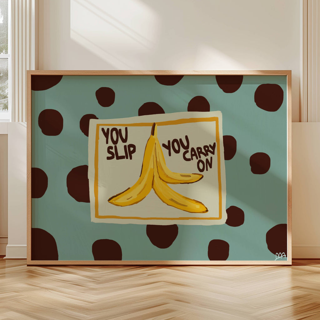 Funny Playful Hand drawn Kitchen wall art with a banana peel illustration and the phrase "You Slip You Carry On" on a blue polka dot background. This is a hand drawn Food Oil Painting kitchen and bar cart art Print decor for playful kitchens, dining spaces and eclectic interiors.