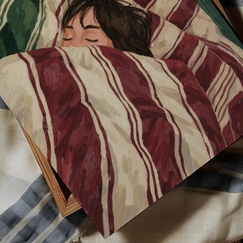 against all productivity is a hand painted wall art print of a sleeping womam in striped bedding, in green and burgundy tones, inspired by slow mornings and nostalgic interiors, symbolizing quiet luxury and unhurried mornings. Horizontal above bed oil painting wall art print . sunday morning aesthetic intimate wall art