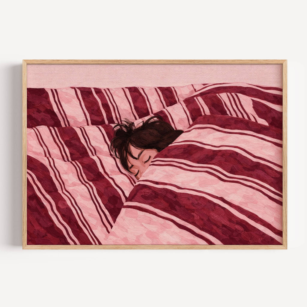 against all productivity is a hand painted wall art print of a sleeping womam in striped bedding, in pink and burgundy tones, inspired by slow mornings and nostalgic interiors, symbolizing quiet luxury and unhurried mornings. Horizontal above bed oil painting wall art print . sunday morning aesthetic intimate wall art