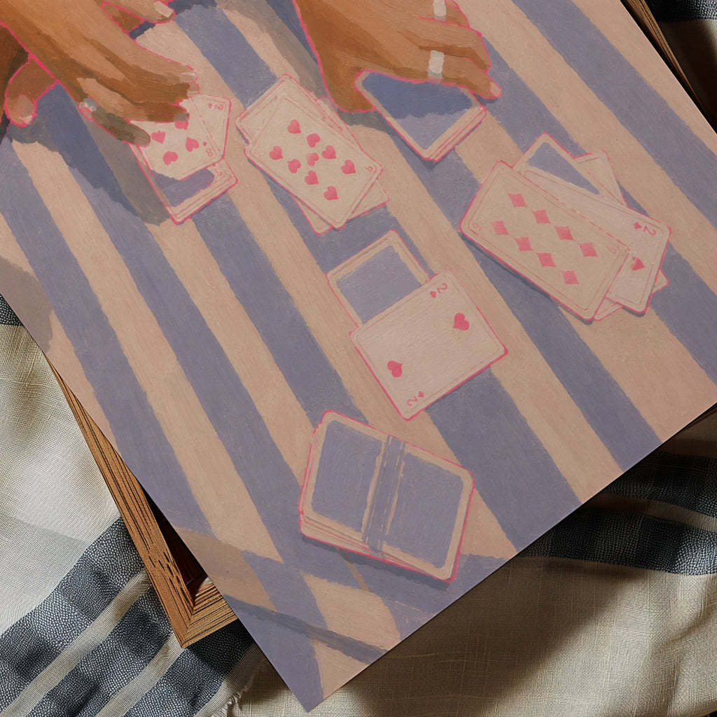 Deal Me Summer captures the carefree rhythm of Mediterranean afternoons, where striped towels become the game table and every hand feels like an excuse to stay a little longer. Inspired by beach clubs, yacht escapes and endless coastal holidays, the artwork celebrates the simple luxury of time well spent. The composition focuses on hands, jewellery and scattered playing cards, transforming an everyday moment into a nostalgic scene of connection, leisure and effortless elegance. Rich painterly textures and a