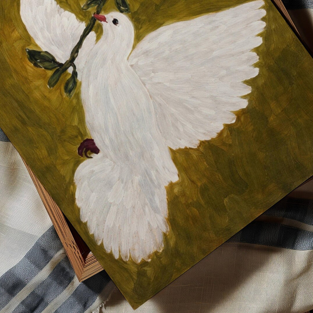 White dove with outstretched wings on a green background
