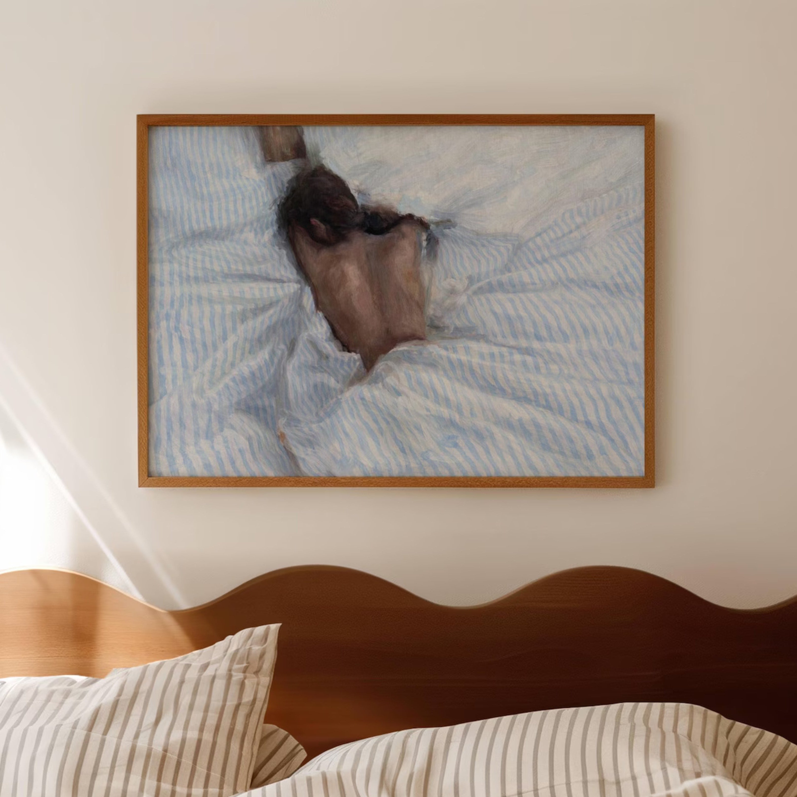 the art of staying is a hand painted wall art print of a sleeping womam in striped bedding, in light blue and butter yellow tones, inspired by slow mornings and nostalgic interiors, symbolizing quiet luxury and unhurried mornings. Horizontal above bed oil painting wall art print . sunday morning aesthetic intimate wall art