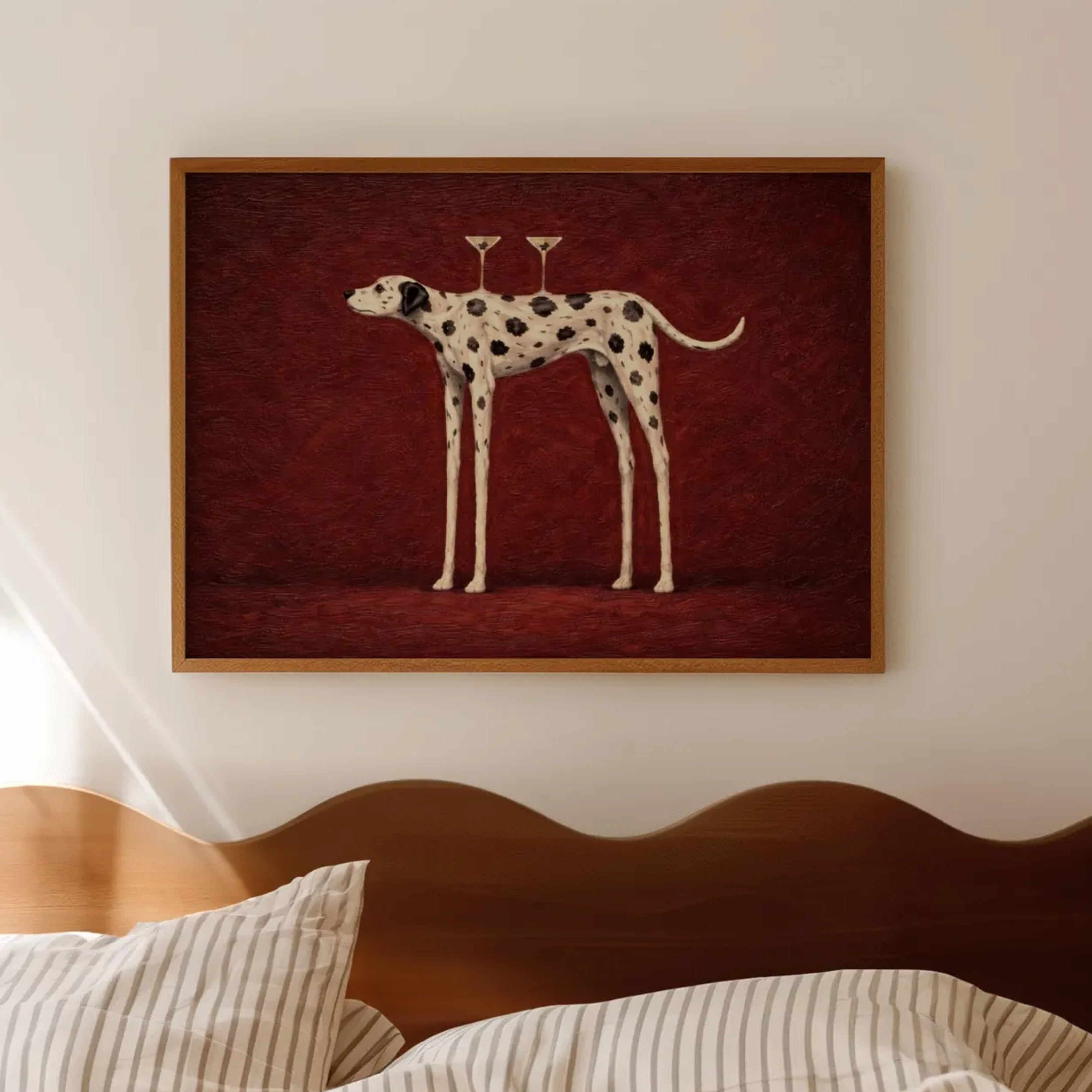 the cocktail dalmatian is a surreal hand painted Minimalist Contemporary whimsical wall art print of a dalmatian dog balancing two martini glasses against a burgundy background, inspired by quiet luxury interiors with expressive painterly texture. Surreal Minimalist Mid century modern dalmatian dog oil painting in cinematic nostalgia composition.