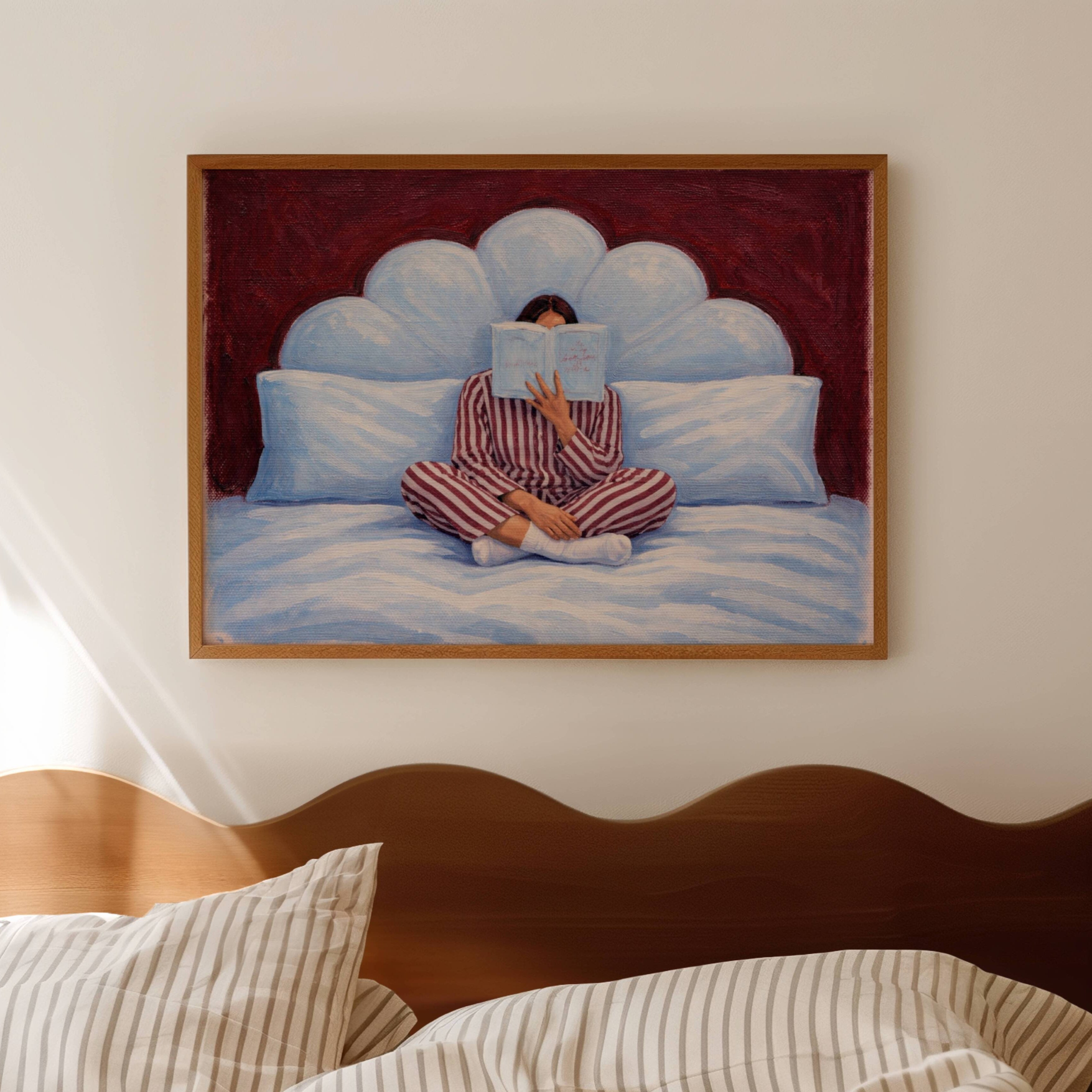 the last good habit is a hand painted wall art print of a womam reading in bed wearing her striped pyjamas, in blue and ruby tones, inspired by vintage glamour and maximalist cinematic luxury interiors, symbolizing femininity and nostalgic interiors. Horizontal above bed oil painting wall art print
