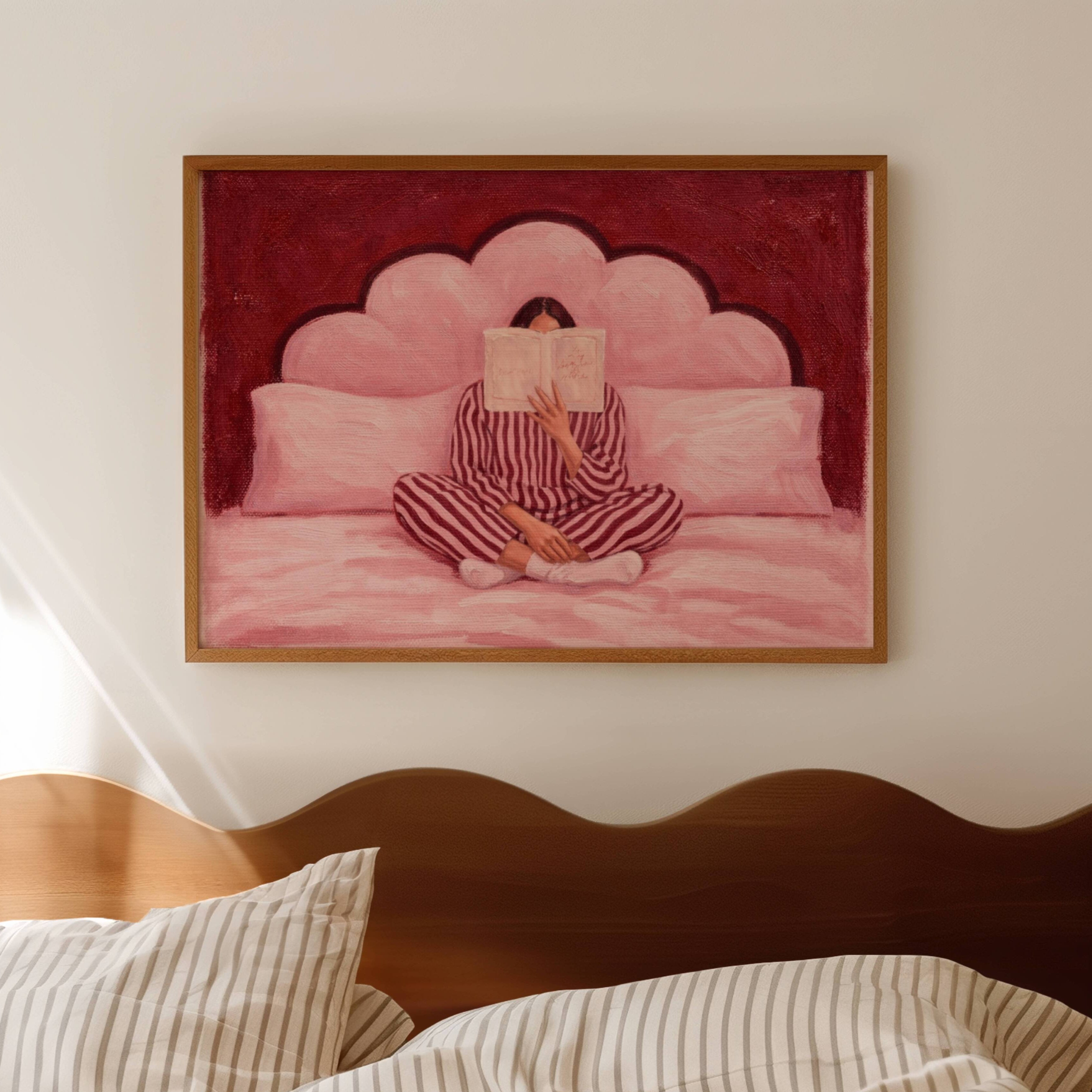 the last good habit is a hand painted wall art print of a womam reading in bed wearing her striped pyjamas, in dusty pink and ruby tones, inspired by vintage glamour and maximalist cinematic luxury interiors, symbolizing femininity and nostalgic interiors. Horizontal above bed oil painting wall art print
