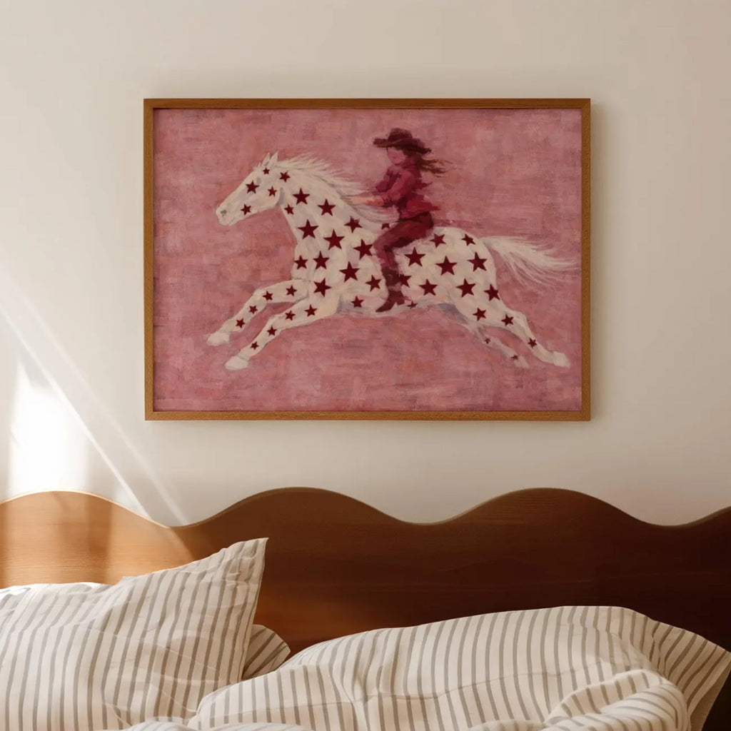 contemporary western folk style artwork of a cowgirl woman riding a star patterned horse with red burgundy stars on a pink background. hand drawn painterly effect