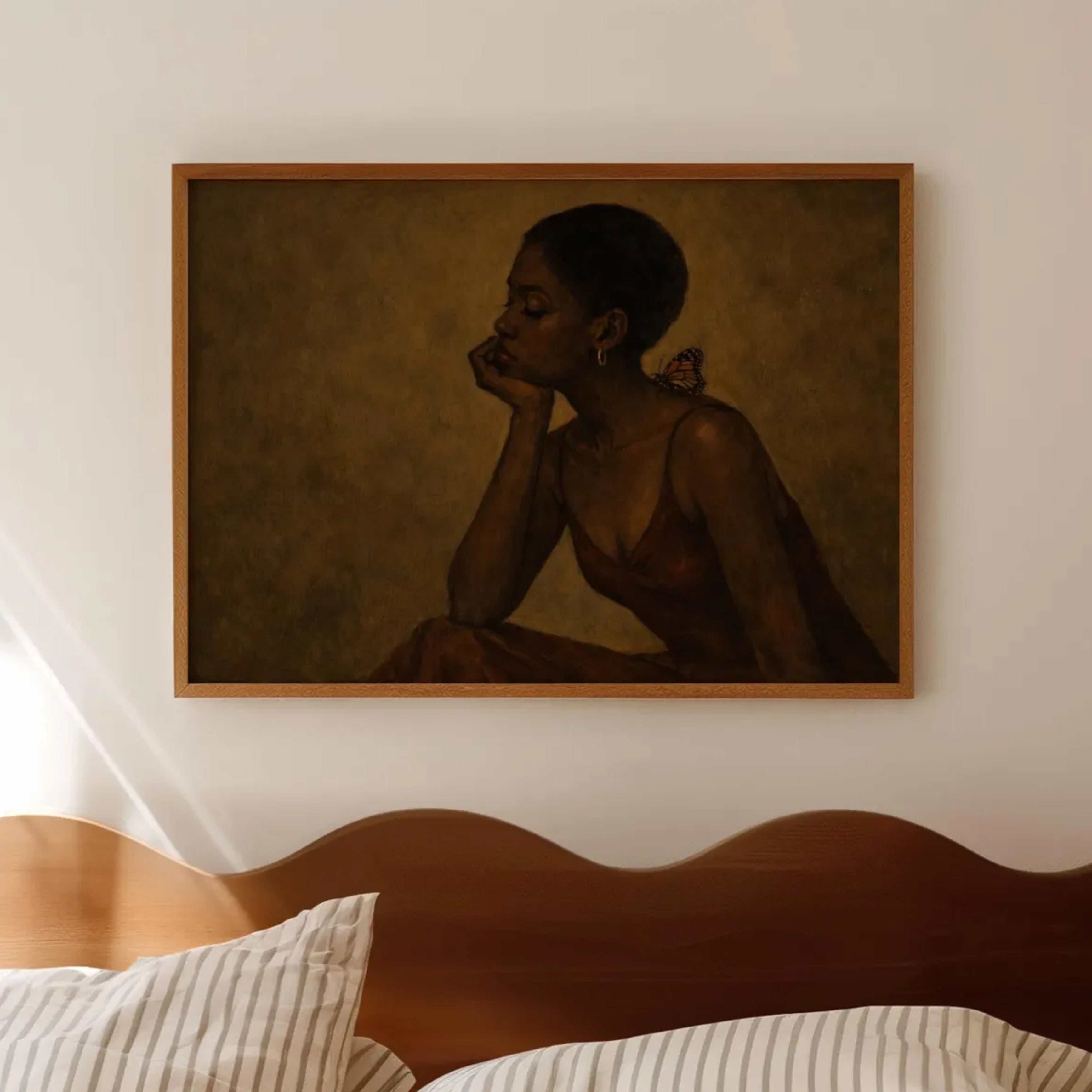 The weight of beautiful things is a hand painted contemporary figurative wall art print of a black woman with a butterfly, inspired by contemporary figurative painting, the value of friendship, cinematic images, the melancholy beauty of simple pleasures, bringing storytelling, atmosphere and afrocentric wall art. large textured canva khaki oil painting wall art print