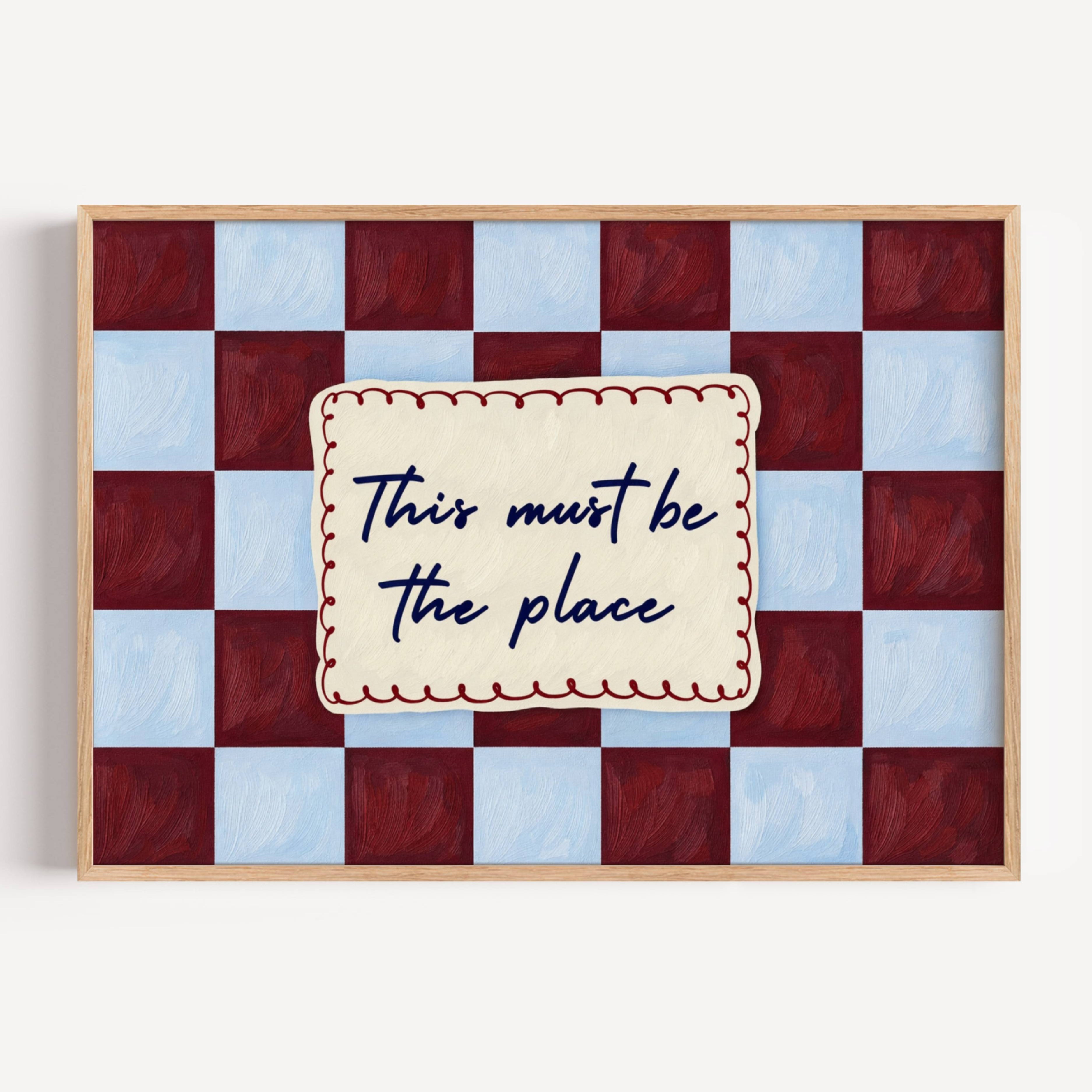 hand drawn Playful typography print with the phrase "this must be the place" in a retro checkerboard blue and ruby burgundy, on textured oil painting canva. This is a hand drawn trendy typography ideal for above bed, bedrooms, dorm room decor, living rooms and kitchens, gallery walls and playful interiors.