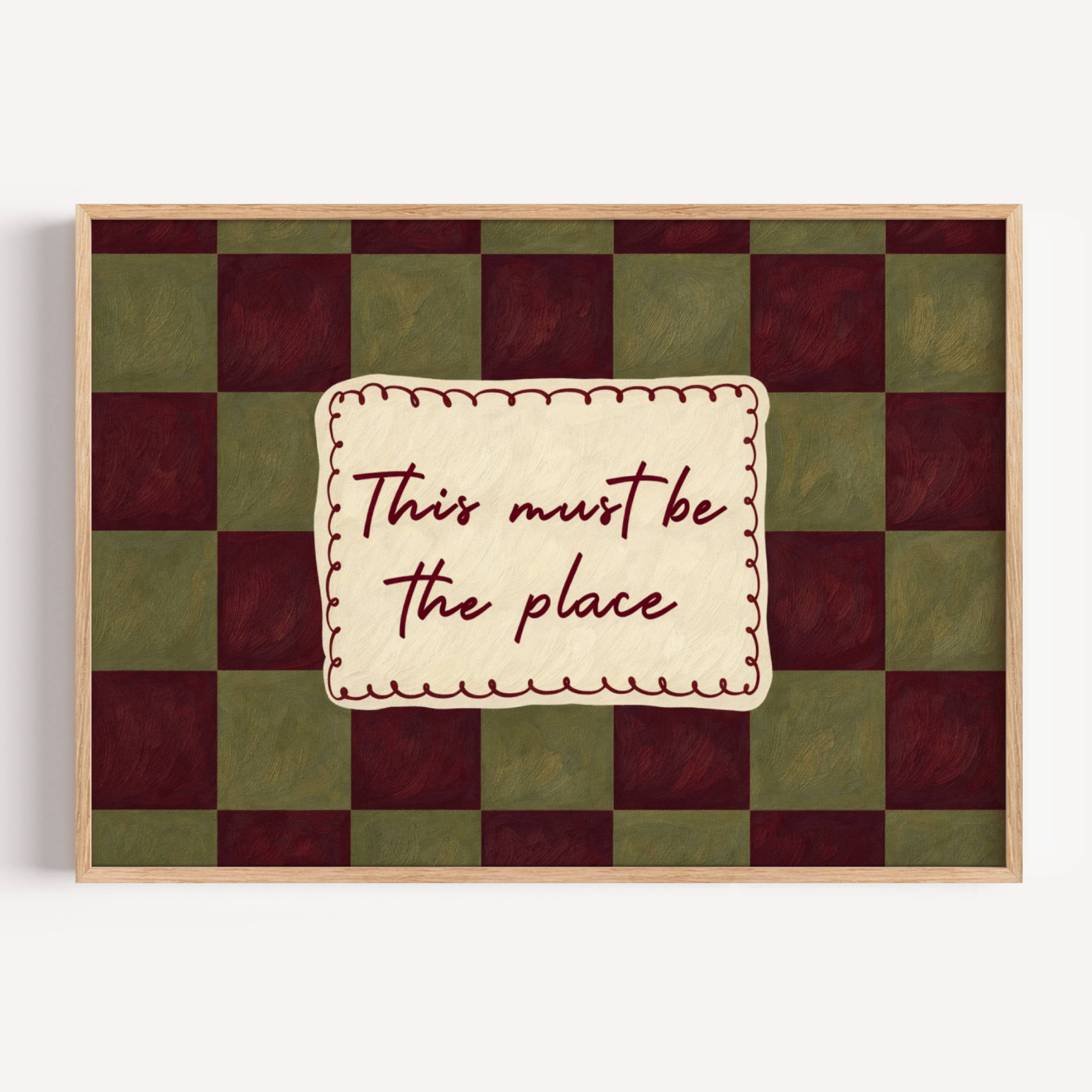 hand drawn Playful typography print with the phrase "this must be the place" in a retro checkerboard khaki and ruby burgundy, on textured oil painting canva. This is a hand drawn trendy typography ideal for above bed, bedrooms, dorm room decor, living rooms and kitchens, gallery walls and playful interiors.