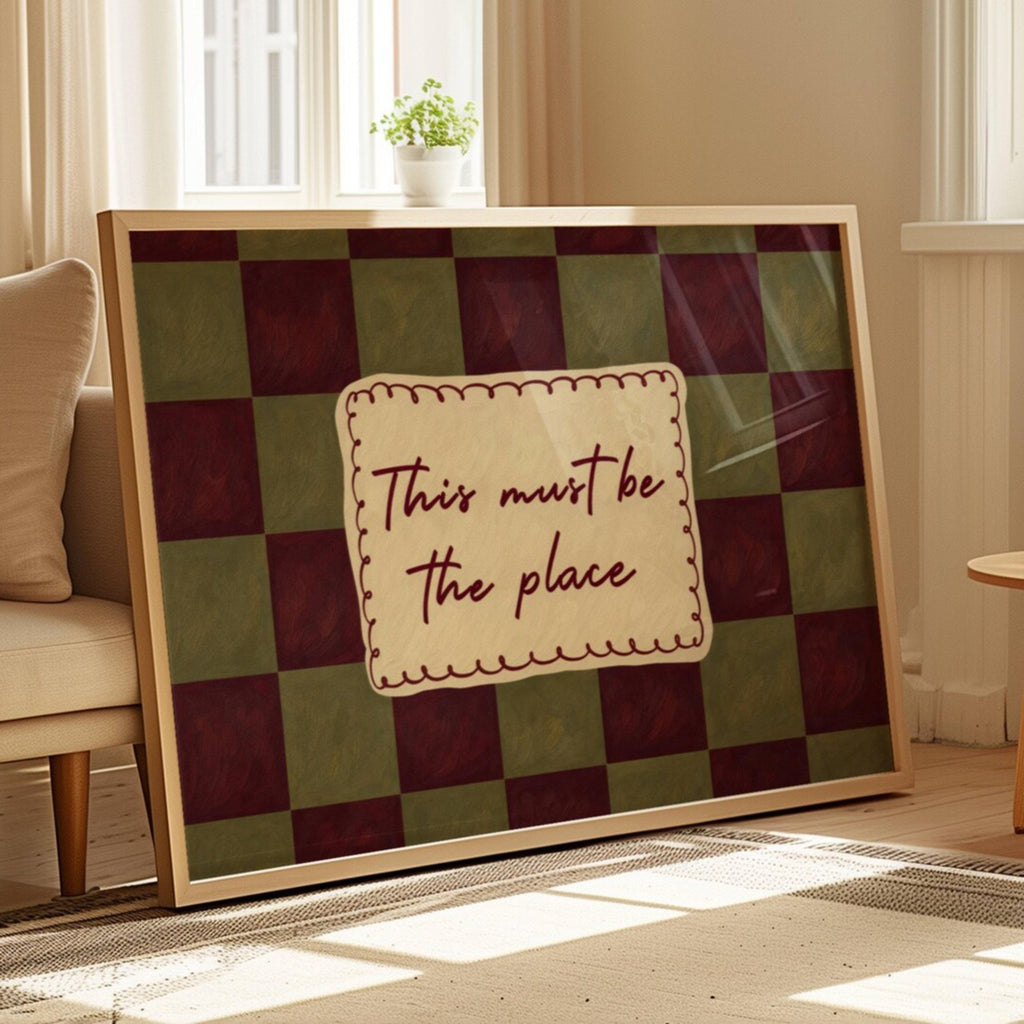 hand drawn Playful typography print with the phrase "this must be the place" in a retro checkerboard khaki and ruby burgundy, on textured oil painting canva. This is a hand drawn trendy typography ideal for above bed, bedrooms, dorm room decor, living rooms and kitchens, gallery walls and playful interiors.