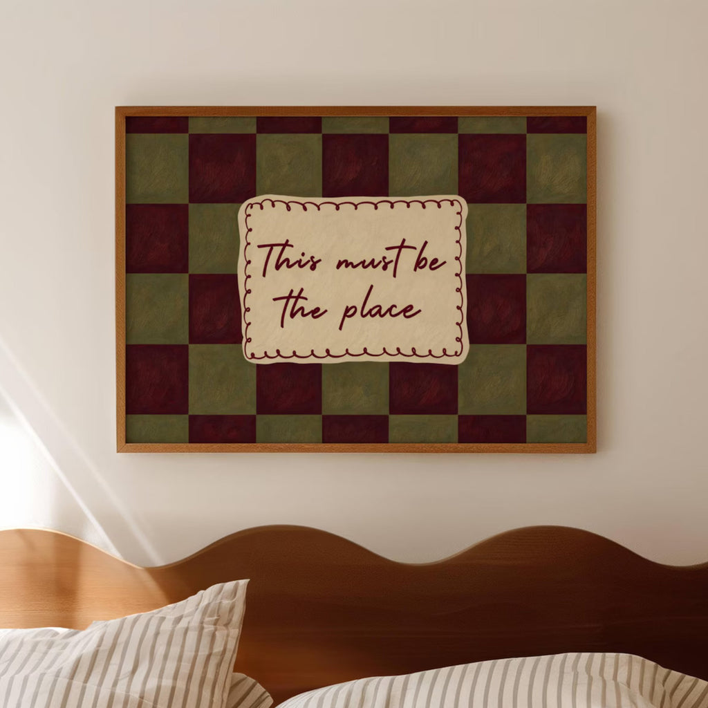 hand drawn Playful typography print with the phrase "this must be the place" in a retro checkerboard khaki and ruby burgundy, on textured oil painting canva. This is a hand drawn trendy typography ideal for above bed, bedrooms, dorm room decor, living rooms and kitchens, gallery walls and playful interiors.