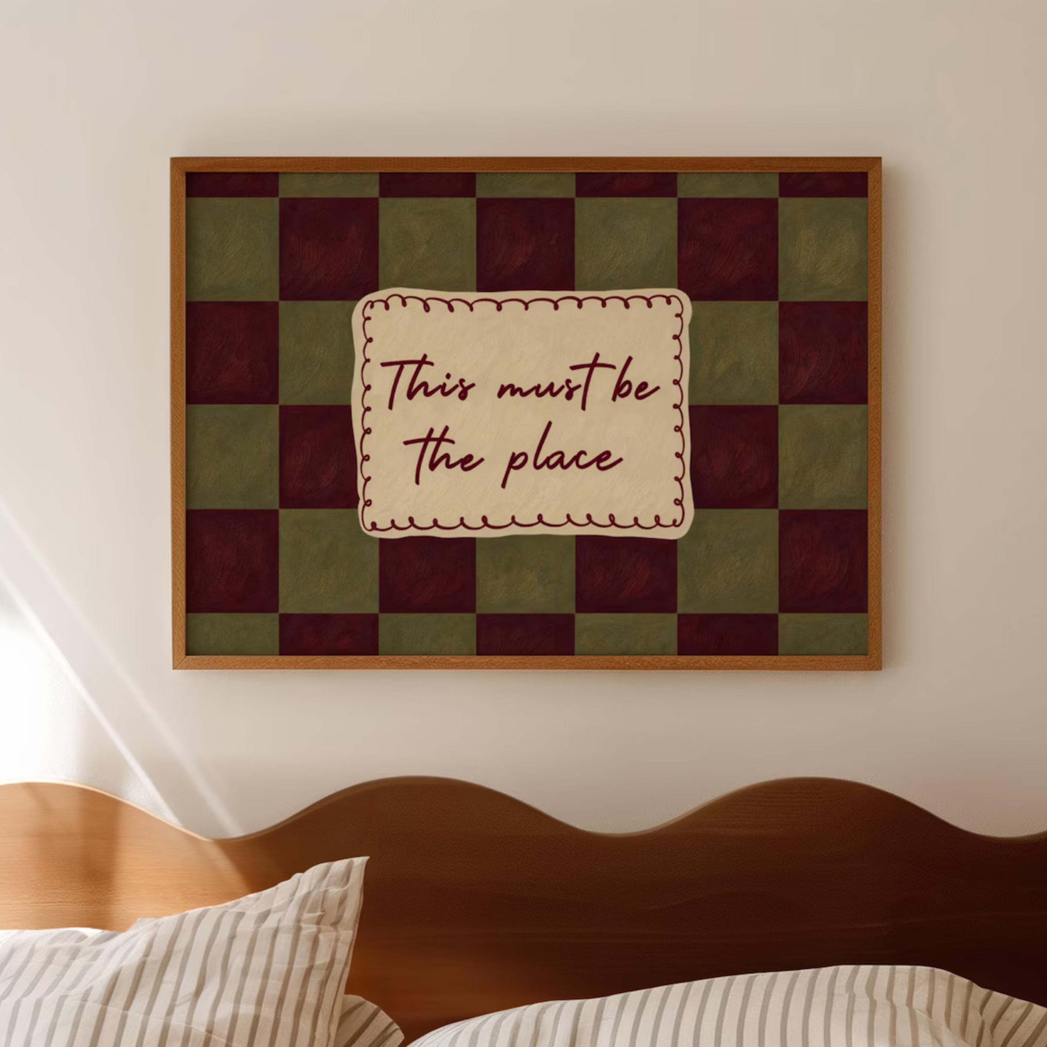 hand drawn Playful typography print with the phrase "this must be the place" in a retro checkerboard khaki and ruby burgundy, on textured oil painting canva. This is a hand drawn trendy typography ideal for above bed, bedrooms, dorm room decor, living rooms and kitchens, gallery walls and playful interiors.