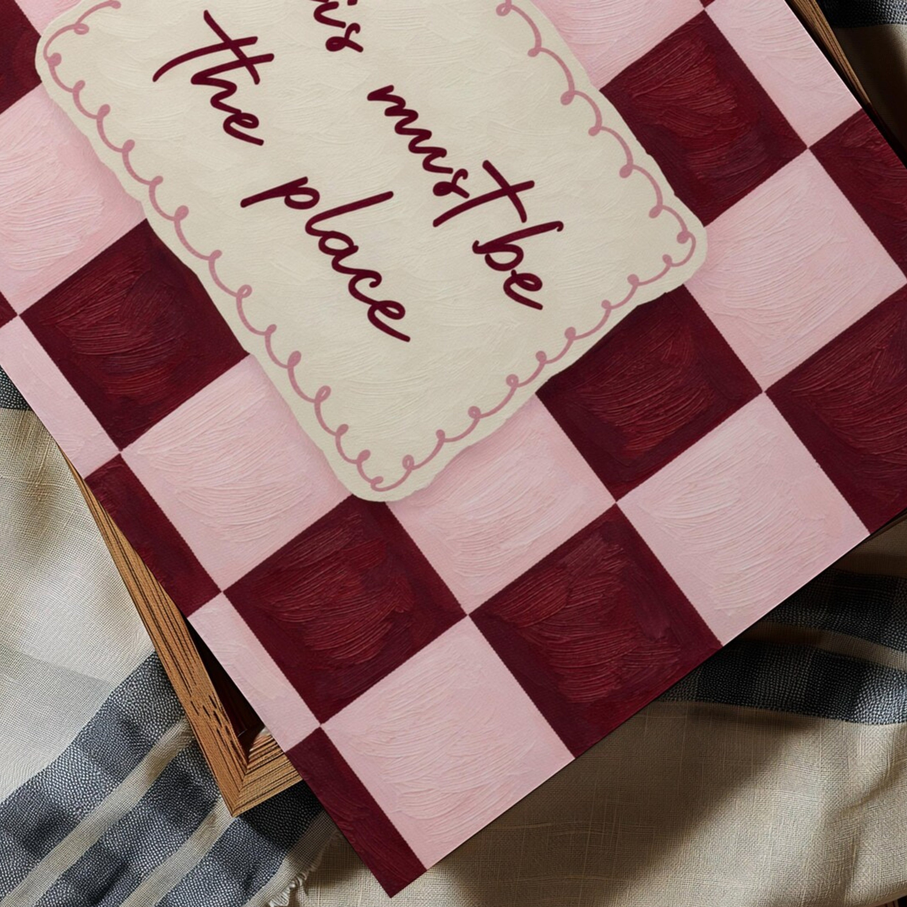 hand drawn Playful typography print with the phrase "this must be the place" in a retro checkerboard pink and ruby burgundy, on textured oil painting canva. This is a hand drawn trendy typography ideal for above bed, bedrooms, dorm room decor, living rooms and kitchens, gallery walls and playful interiors.