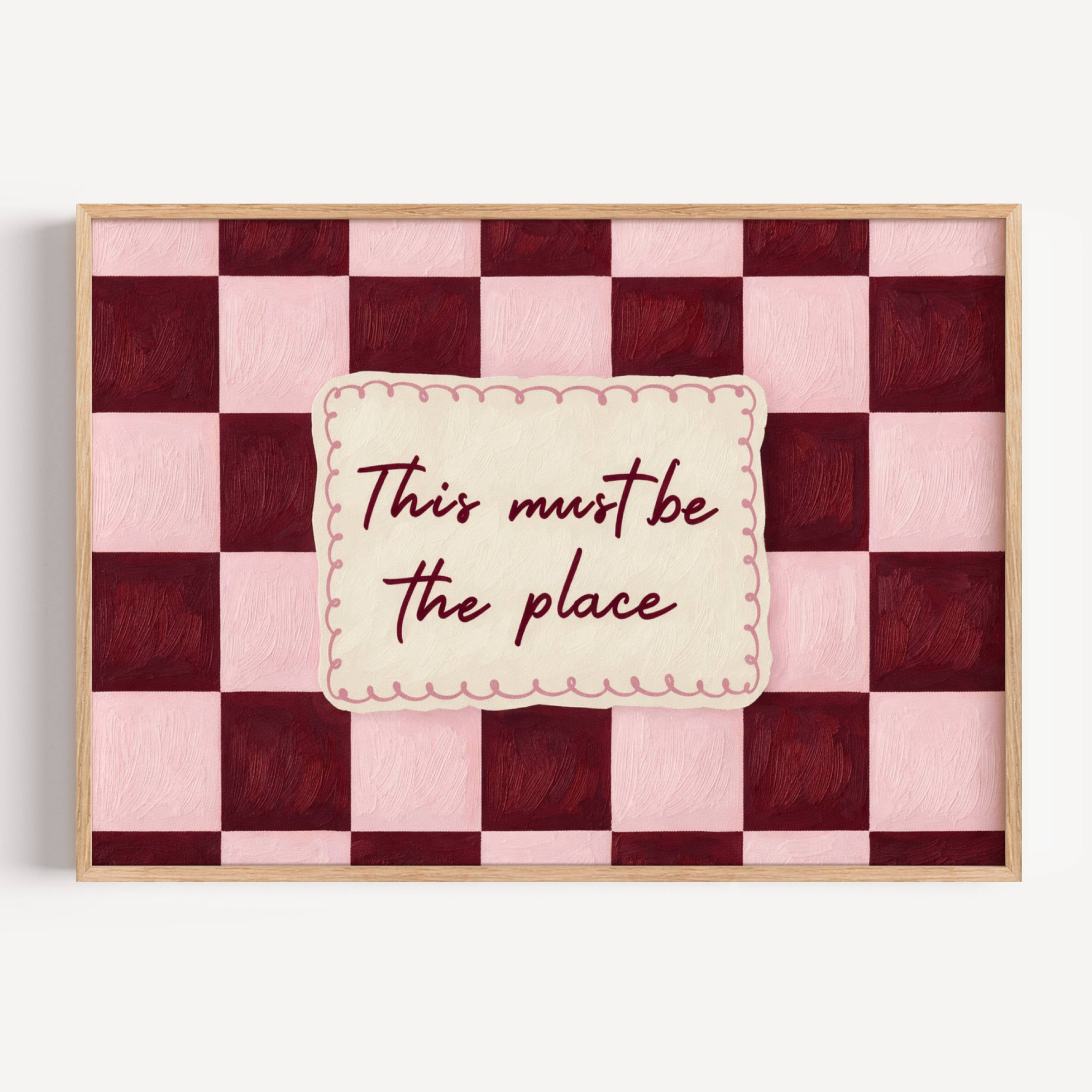 hand drawn Playful typography print with the phrase "this must be the place" in a retro checkerboard pink and ruby burgundy, on textured oil painting canva. This is a hand drawn trendy typography ideal for above bed, bedrooms, dorm room decor, living rooms and kitchens, gallery walls and playful interiors.
