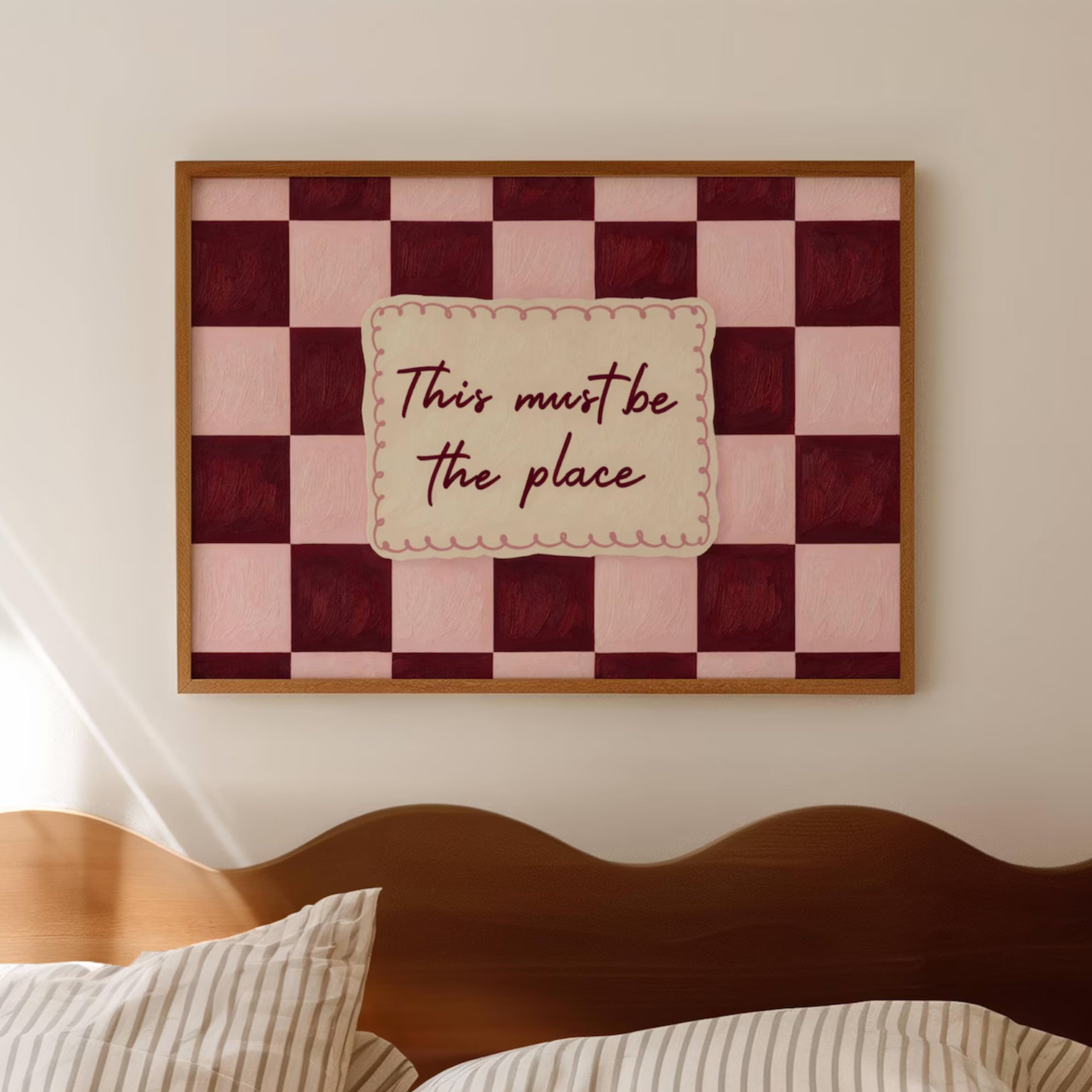 hand drawn Playful typography print with the phrase "this must be the place" in a retro checkerboard pink and ruby burgundy, on textured oil painting canva. This is a hand drawn trendy typography ideal for above bed, bedrooms, dorm room decor, living rooms and kitchens, gallery walls and playful interiors.