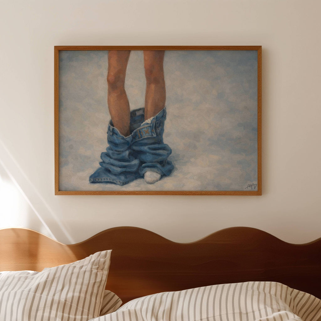 undone is a hand painted Contemporary and figurative feminine wall art print depicting jeans pooled around a figure's legs, exloring femininity, intimacy and quiet daily rituals, against a light blue background with expressive painterly texture. Minimalist Mid century modern oil painting in cinematic nostalgia composition.