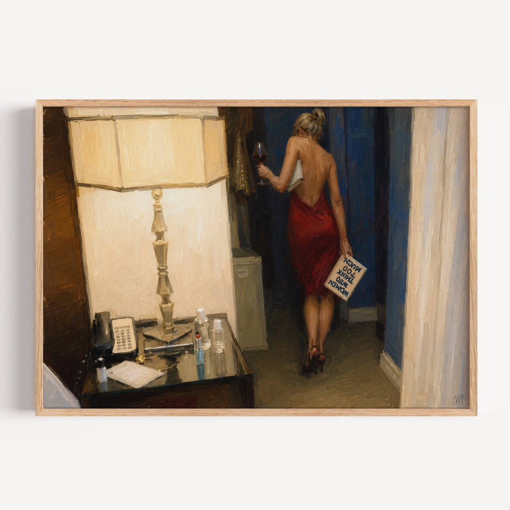 Framed artwork of a woman in a red dress holding a book and a glass of wine, standing in a room with a lamp and desk.